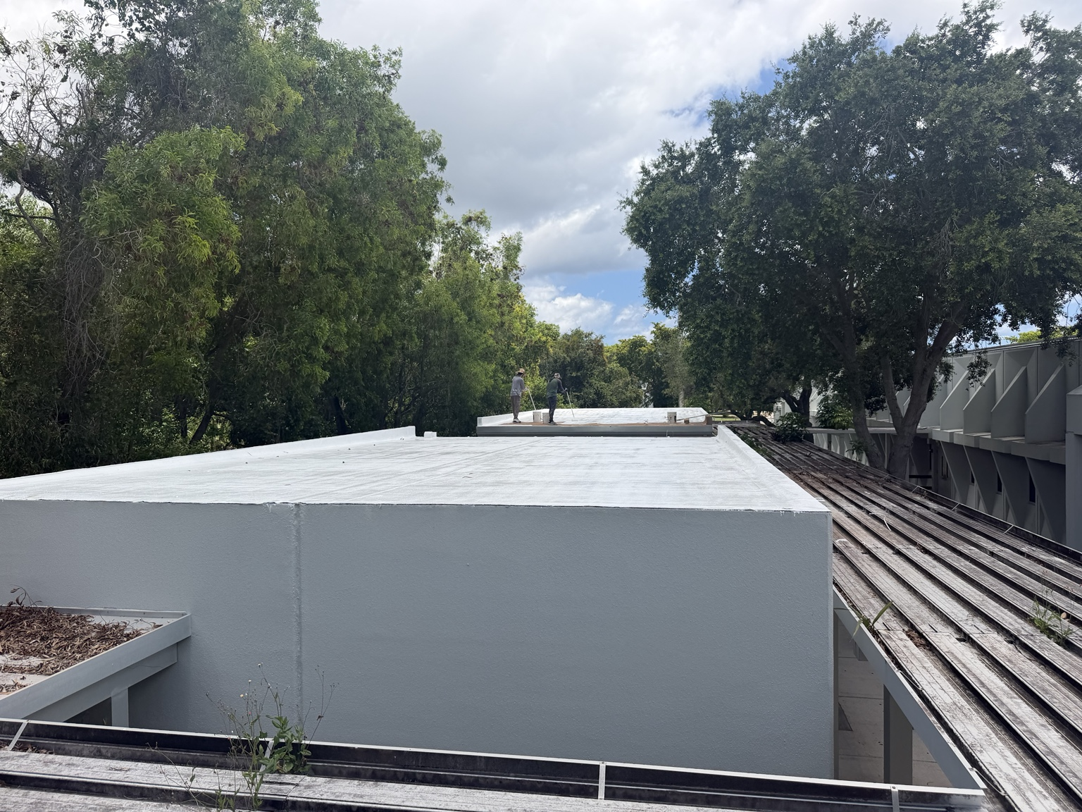 Completed white roof coating on a South Florida commercial building